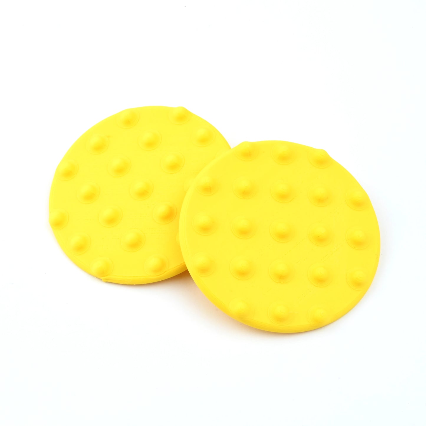 Oversized yellow round Disk Earrings with Raised Dots on a white background.
