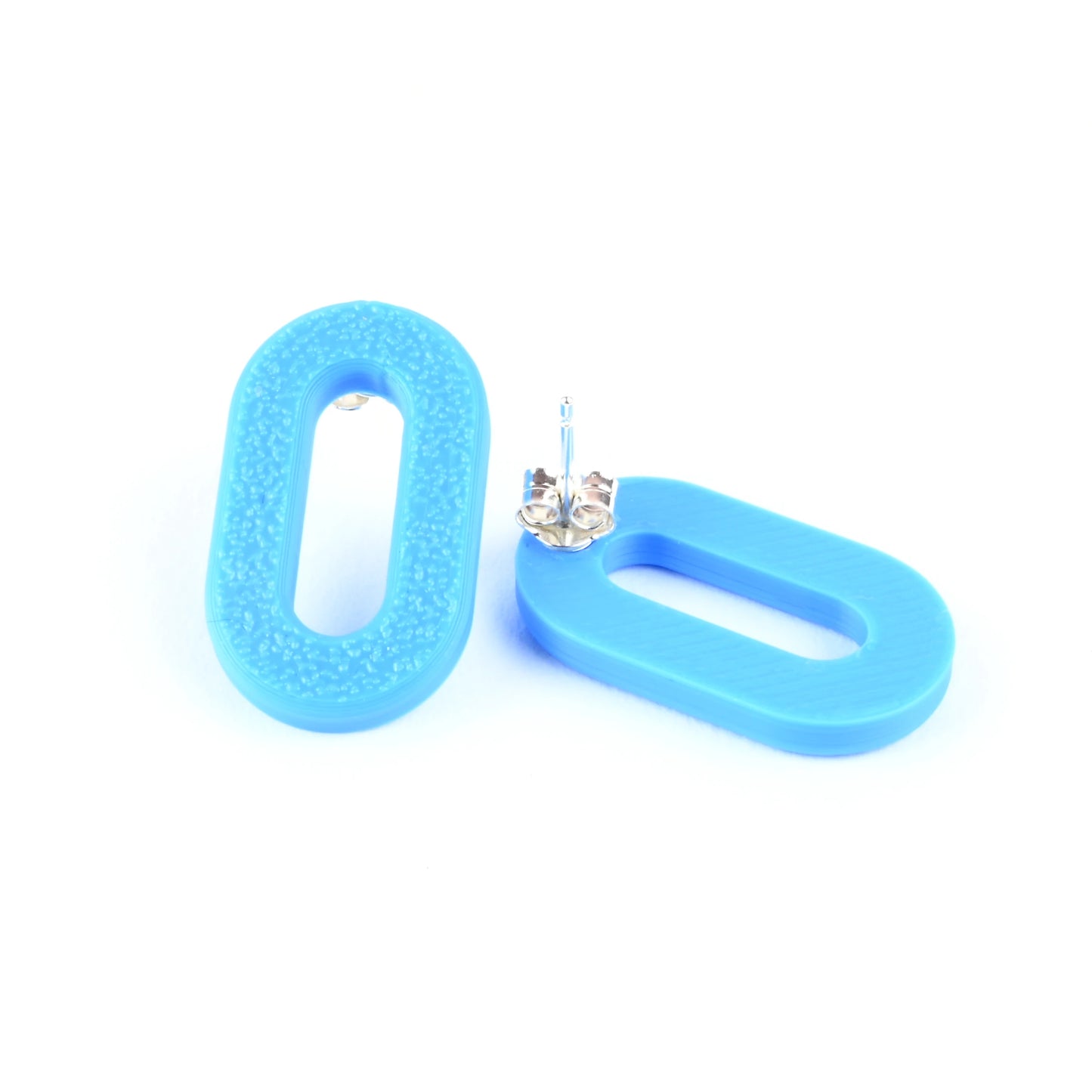 Cyan blue oval earrings on a white background