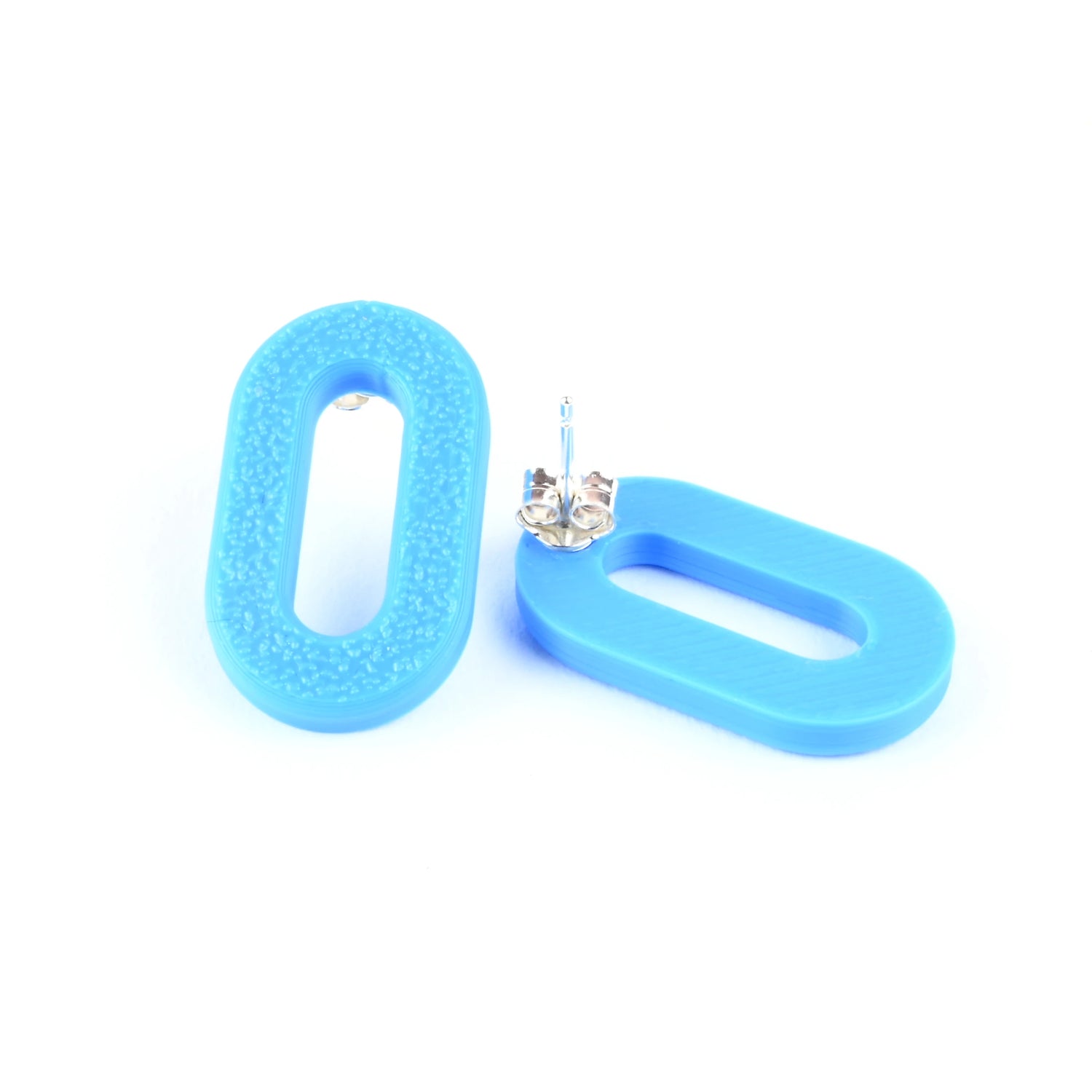 Cyan blue oval earrings on a white background
