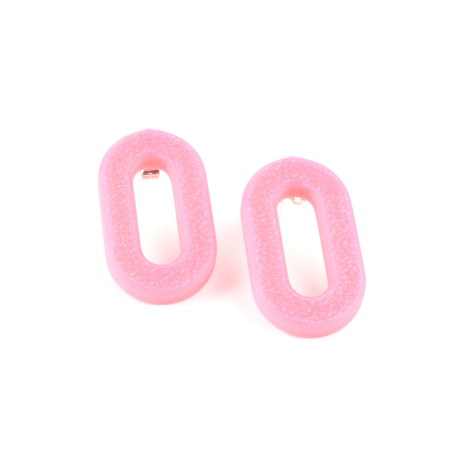 Pair of pink oval earrings on a white background