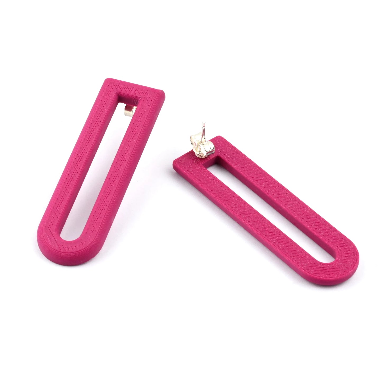 Two plum U-shaped drop earrings on a white background