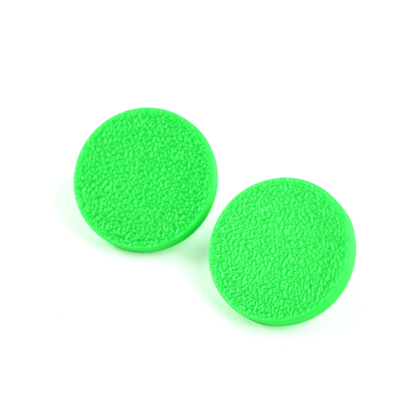 Two green stud earrings with textured surface on a white background