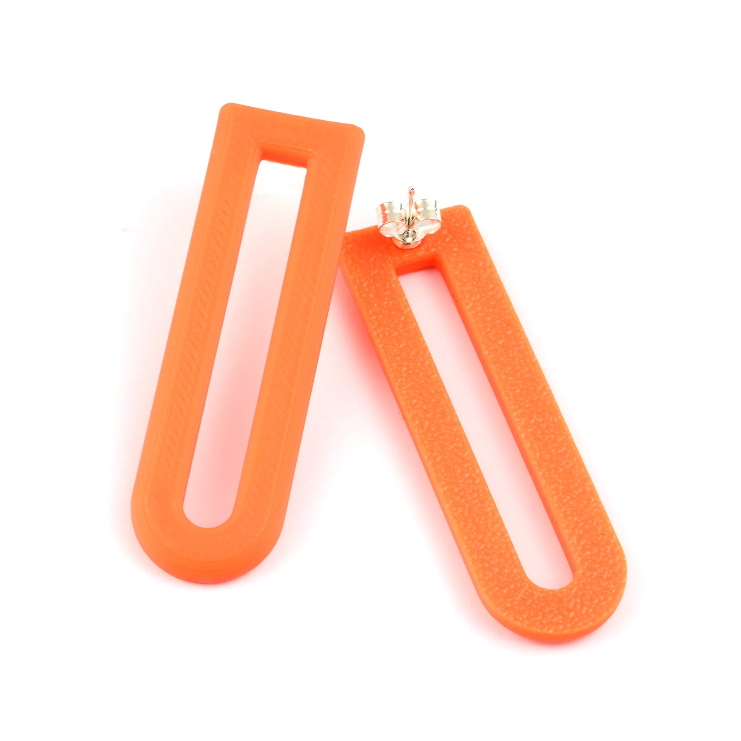 Pair of orange U shaped drop earrings with silver ear posts on a white background