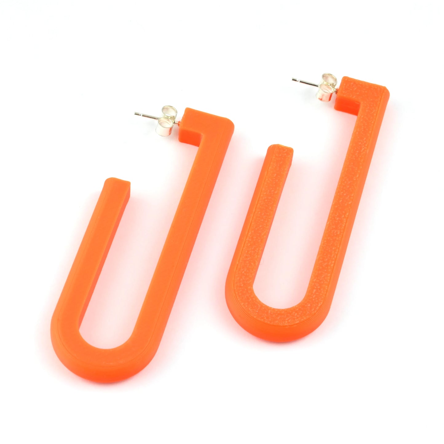 Orange U-shaped hoop earrings on a white background