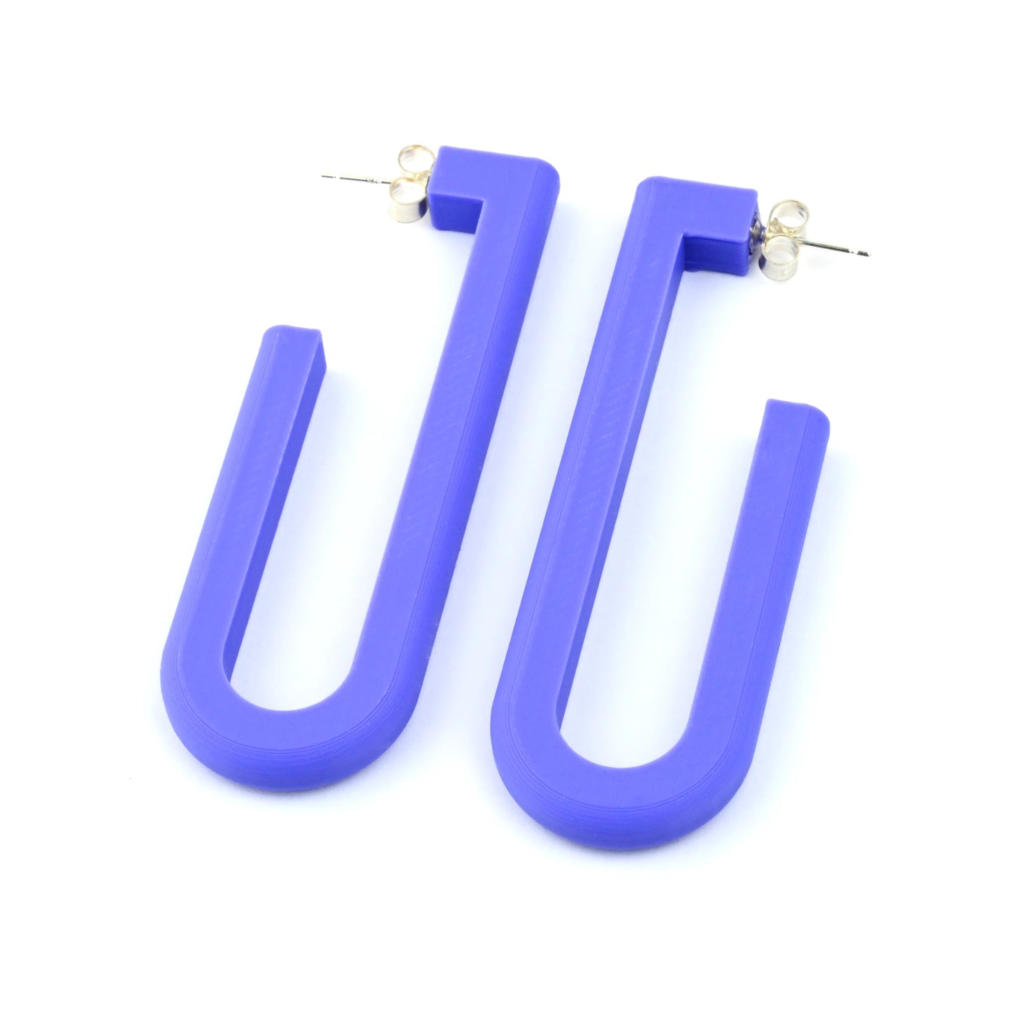 Purple U-shaped hoop earrings on a white background