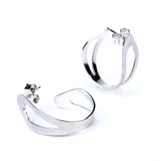 Sterling silver organic hoop earrings by Roxwoods on a white background