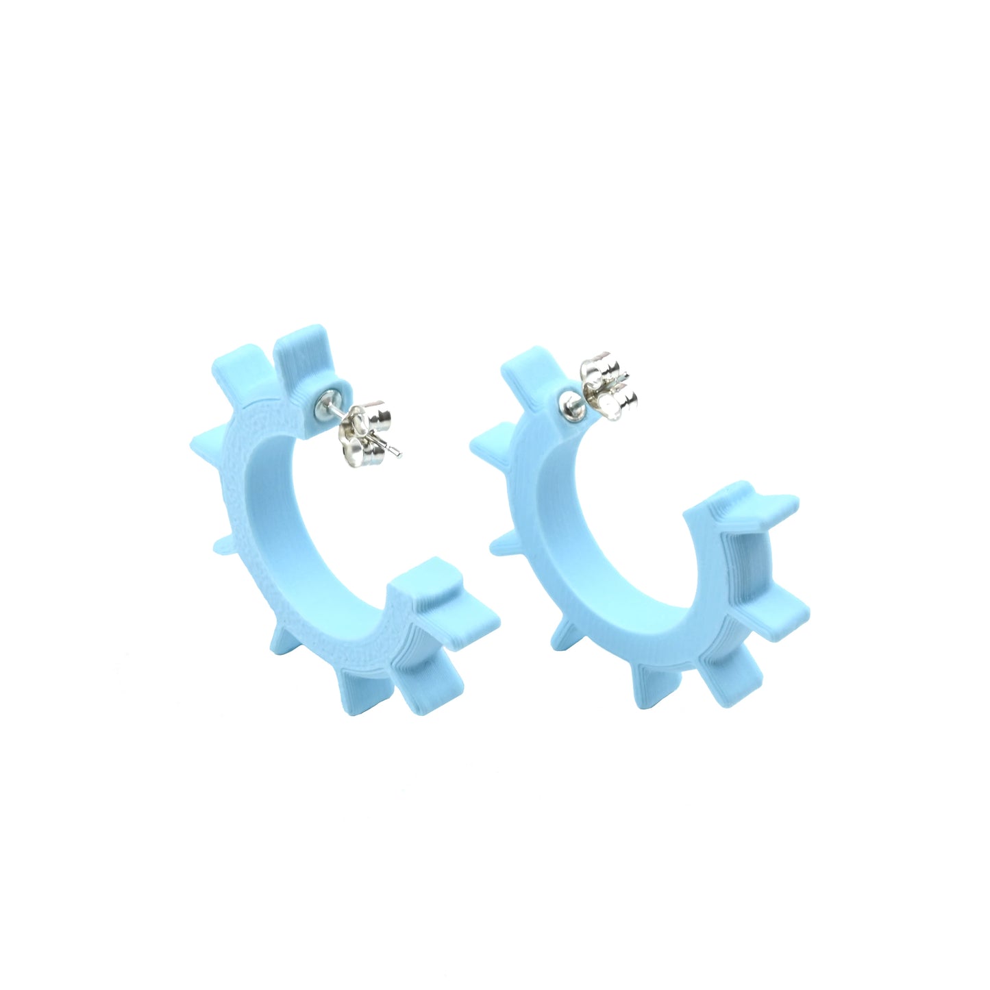 Light blue hoop earrings on a white background with silver ear posts.