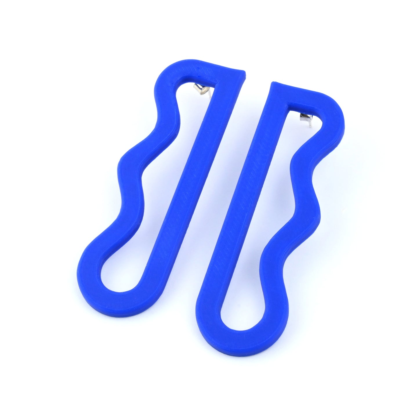 Pair of blue wavy drop earrings on a white background