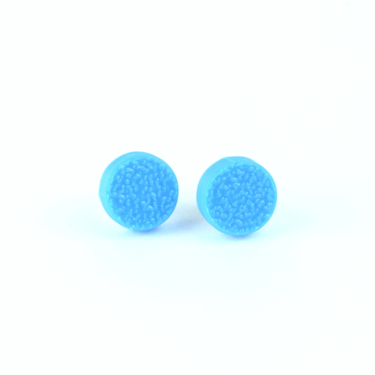 Pair of cyan blue textured round stud earrings on a white background