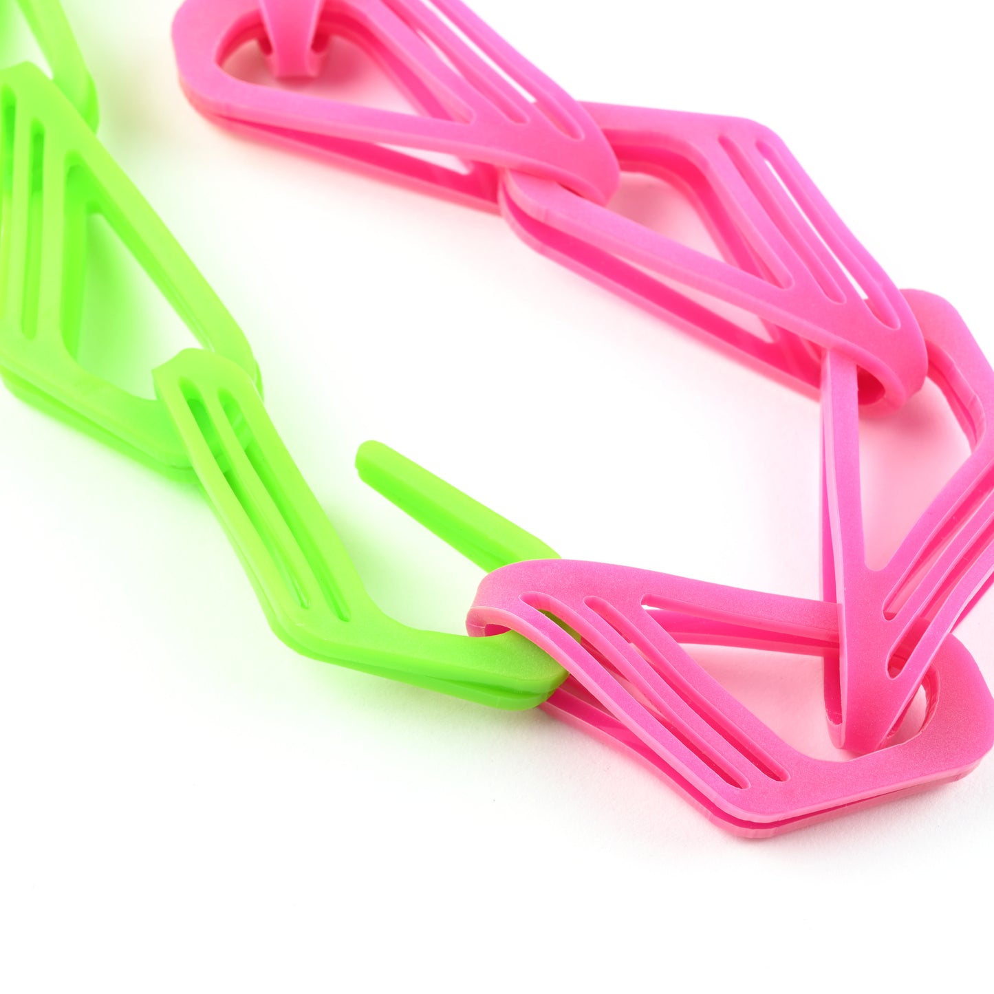 hook end of a lime green and pink chain necklace on a white background. 