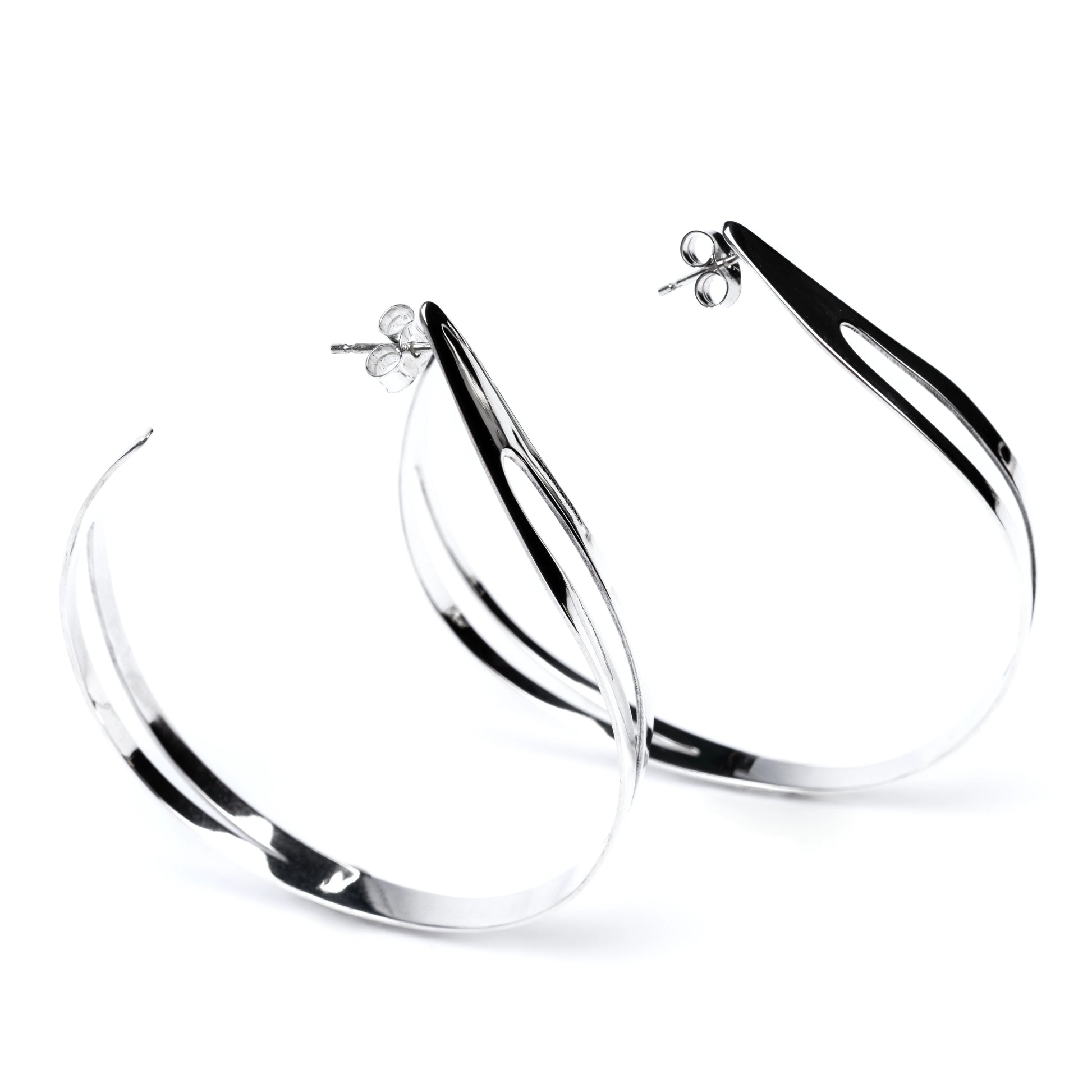 Pair of highly polished silver hoop earrings on a white background