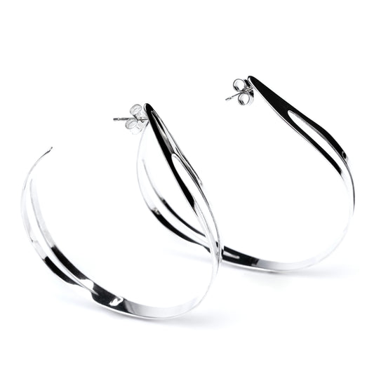 Pair of highly polished silver hoop earrings on a white background