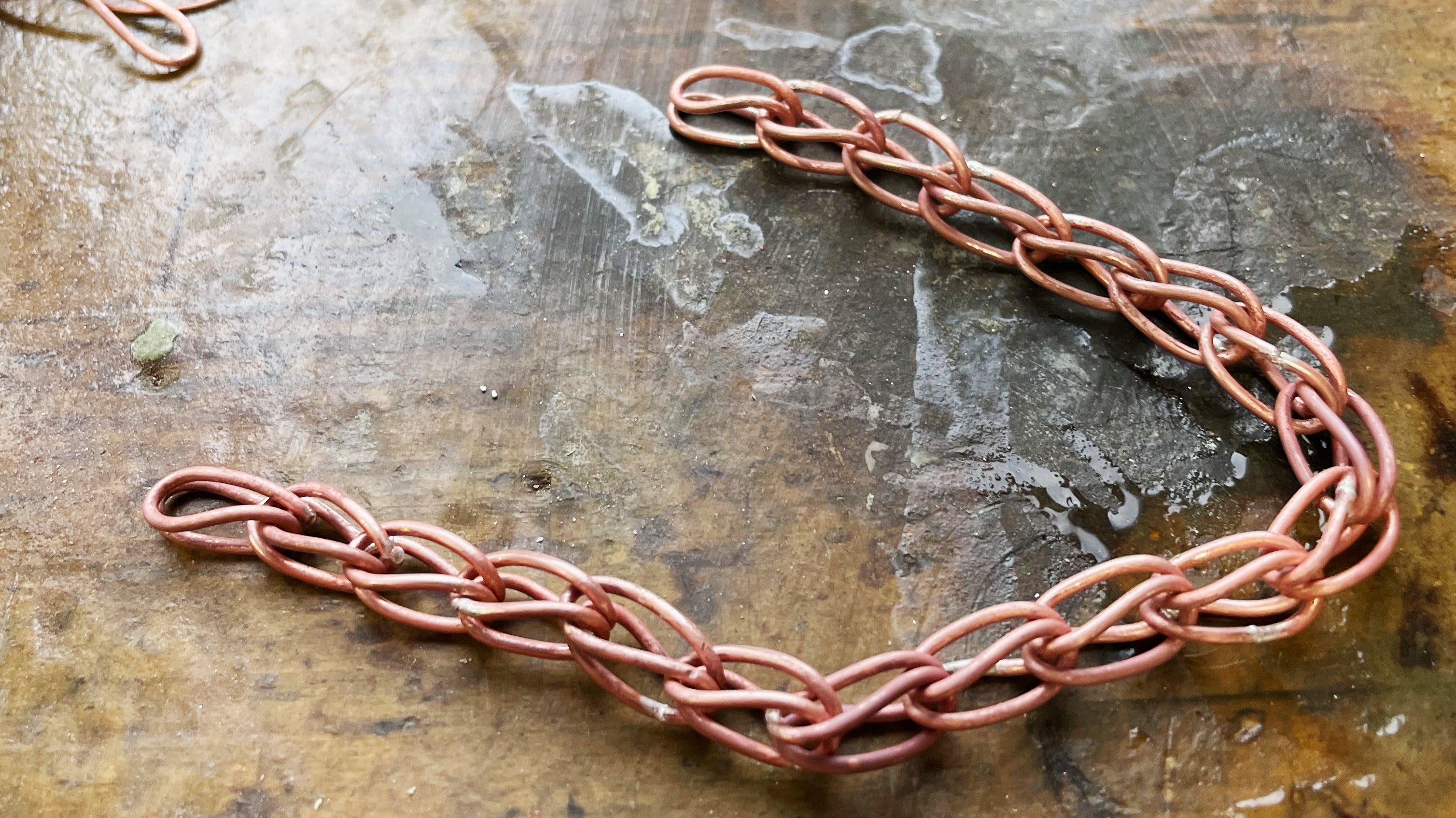 Loop-in-loop chain made using thick copper wire in large size.
