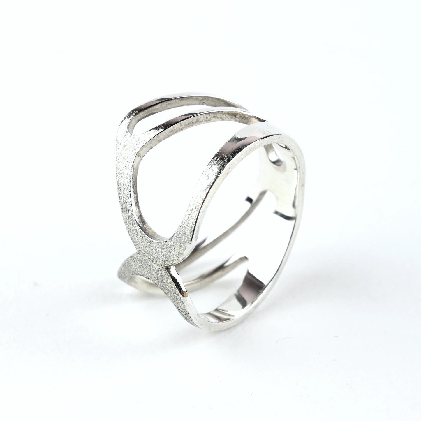 Silver ring with a modern design on a white background