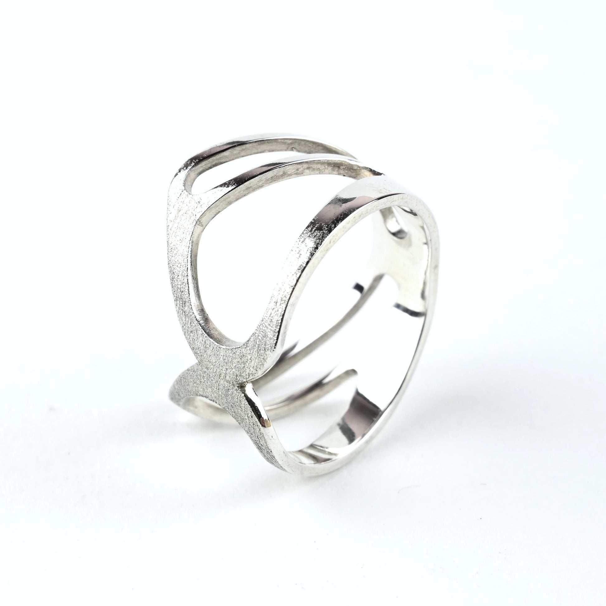 Silver ring with a modern design on a white background