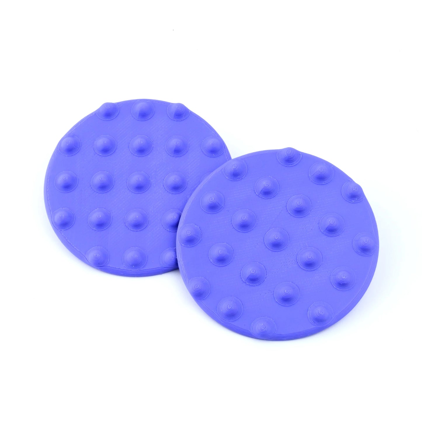 Pair of Oversized Disk Stud Earrings with raised dot details, overlap on a white background.