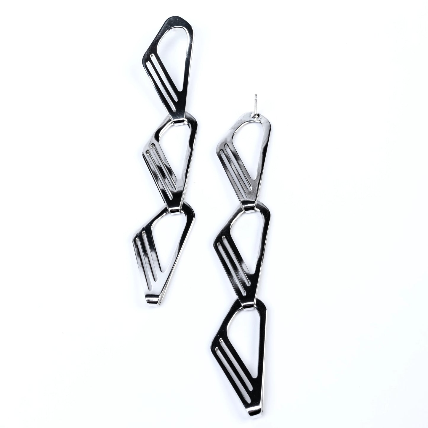 Geometric silver earrings on a white background