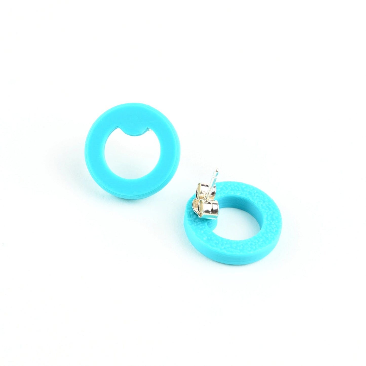 Turquoise round stud earrings on a white background