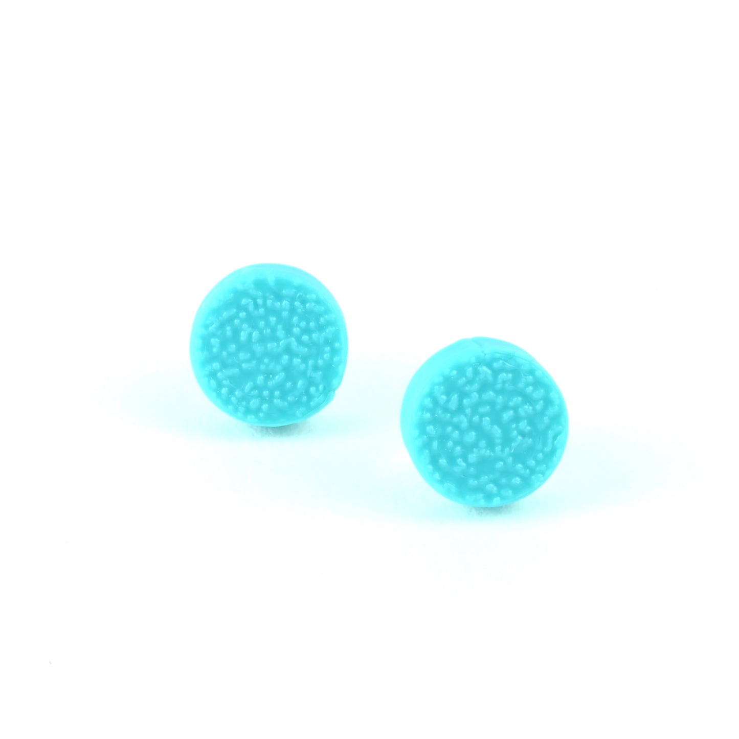 Pair of turquoise tiny stud earrings on a white background