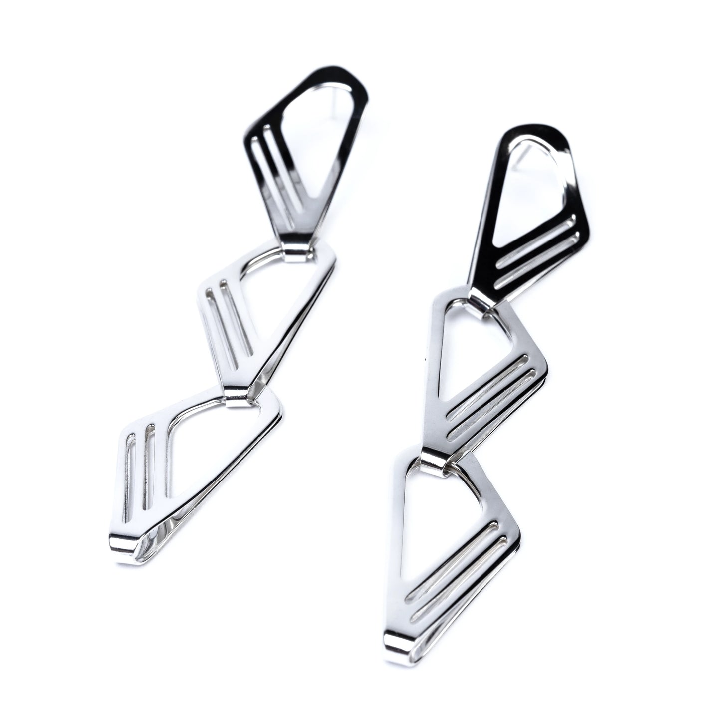 Pair of silver earrings with geometric design on a white background