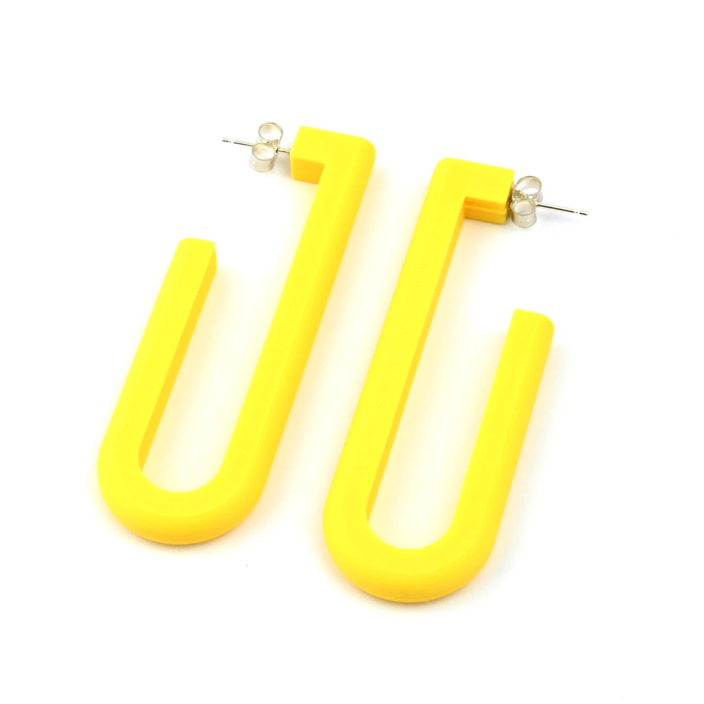 Yellow U-shaped hoop earrings on a white background